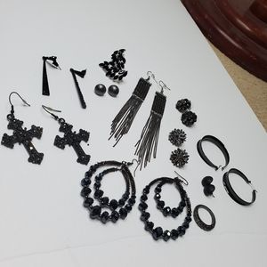 Assorted black earrings and hoops